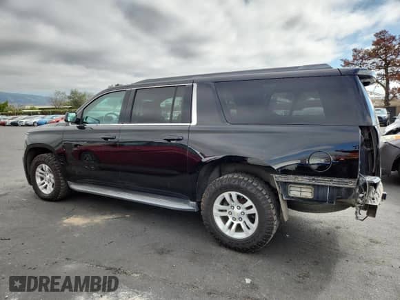 2015 Chevrolet Suburban LT with VIN 1GNSKJKC6FR660894, listed as a Copart auction lot 82732065 with 47,176 mi miles and Salvage title. Bid and sale history available at DreamBid. Image 2.