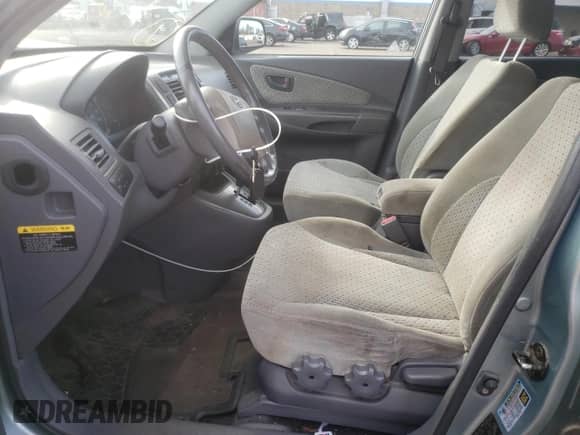 2005 Hyundai Tucson GLS z VIN KM8JN72D75U080052, wystawiony jako Copart lot #75173014 z przebiegiem 106 479 mil mil oraz Szkoda całkowita • Salvage title. Historia ofert i sprzedaży dostępna na DreamBid. Obrazek 7.