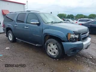 2009 Chevrolet Suburban 2LT z VIN 1GNFK26379R209463, wystawiony jako IAAI lot #42505241 z przebiegiem 304 821 mil mil oraz . Historia ofert i sprzedaży dostępna na DreamBid. Obrazek 1.