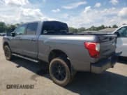 ✅ 2018 Nissan Titan Platinum Reserve • VIN: 1N6BA1F40JN516351 • Lot: 62639775. Listed on Copart with 118,178 mi. Free auction sales archive from the USA and detailed vehicle history report at DreamBid. Image 2.