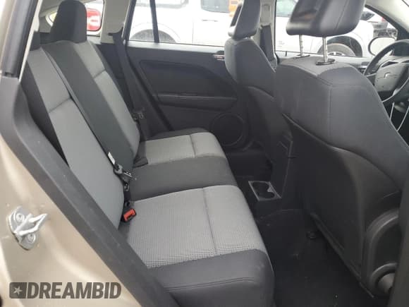 ✅ 2009 Dodge Caliber SXT • VIN: 1B3HB48AX9D259703 • Лот: 80551064. Опубликован ранее на Copart с пробегом 128 818 миль. Бесплатный доступ к архиву аукционных продаж из США и подробный отчёт об истории автомобиля на DreamBid. Изображение 10.