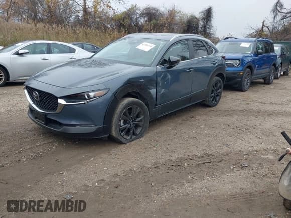 ✅ 2024 Mazda CX-30 S Preferred • VIN: 3MVDMBCM1RM647306 • Lot: 43701334. Listed on IAAI with 25,436 mi. Free auction sales archive from the USA and detailed vehicle history report at DreamBid. Image 2.