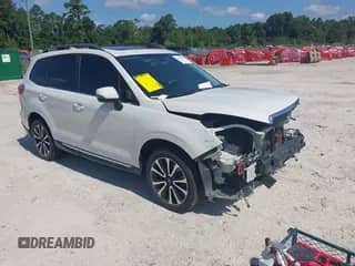 2017 Subaru Forester Touring with VIN JF2SJGWC6HH434017, listed as a IAAI auction lot 42676511 with 110,981 mi miles and . Bid and sale history available at DreamBid. Image 1.