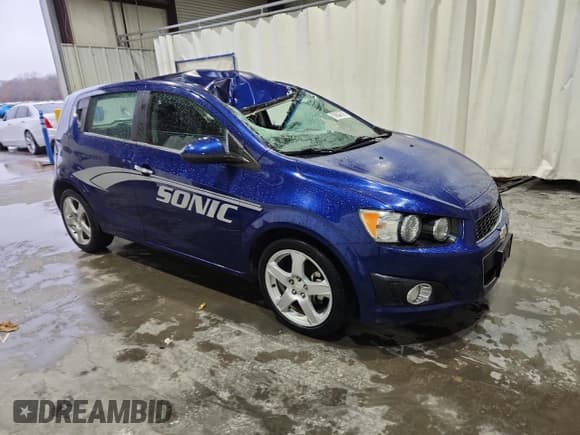 ✅ 2013 Chevrolet Sonic LTZ • VIN: 1G1JE6SB3D4211398 • Lot: 93627505. Listed on Copart with 109,453 mi. Free auction sales archive from the USA and detailed vehicle history report at DreamBid. Image 4.