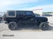 ✅ 2008 Jeep Wrangler Unlimited Sahara • VIN: 1J4GA59188L587606 • Lot: 43082389. Listed on IAAI with 120,757 mi. Free auction sales archive from the USA and detailed vehicle history report at DreamBid. Image 13.