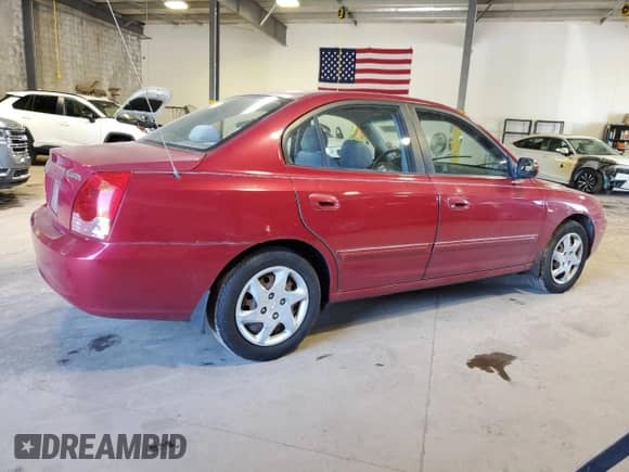 2006 Hyundai Elantra GLS with VIN KMHDN46D16U324883, listed as a Copart auction lot 84821305 with 59,301 mi miles and Salvage title. Bid and sale history available at DreamBid. Image 3.