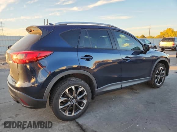 ✅ 2016 Mazda CX-5 Grand Touring • VIN: JM3KE2DY8G0668071 • Лот: 89520365. Опубликован ранее на Copart с пробегом 131 801 миль. Бесплатный доступ к архиву аукционных продаж из США и подробный отчёт об истории автомобиля на DreamBid. Изображение 3.
