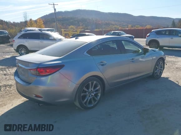 ✅ 2015 Mazda 6 i Grand Touring • VIN: JM1GJ1W56F1213509 • Lot: 43609197. Listed on IAAI with 96,094 mi. Free auction sales archive from the USA and detailed vehicle history report at DreamBid. Image 4.