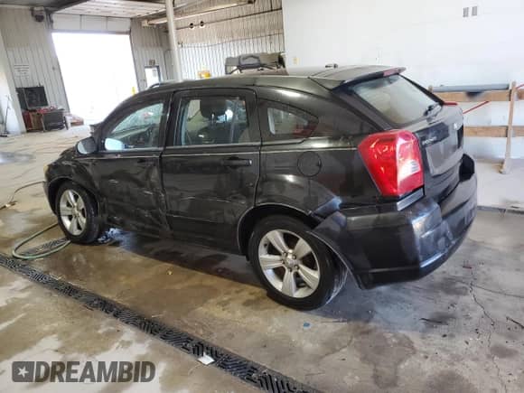 2010 Dodge Caliber SXT z VIN 1B3CB4HA3AD552566, wystawiony jako Copart lot #77544244 z przebiegiem 148 850 mil mil oraz Szkoda całkowita • Salvage title. Historia ofert i sprzedaży dostępna na DreamBid. Obrazek 2.