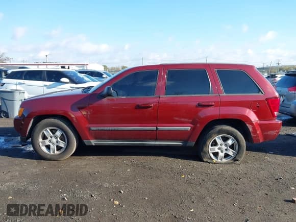 ✅ 2007 Jeep Grand Cherokee Laredo • VIN: 1J8GR48K57C581658 • Lot: 43511336. Listed on IAAI with 128,685 mi. Free auction sales archive from the USA and detailed vehicle history report at DreamBid. Image 14.