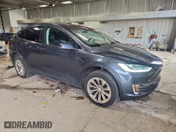 ✅ 2016 Tesla Model X 70D • VIN: 5YJXCBE2XGF019176 • Lot: 94191885. Listed on Copart with 234,701 mi. Free auction sales archive from the USA and detailed vehicle history report at DreamBid. Image 4.