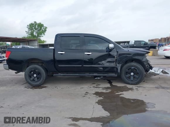 ✅ 2015 Nissan Titan SV • VIN: 1N6BA0ED6FN506832 • Lot: 42145874. Listed on IAAI with 238,722 mi. Free auction sales archive from the USA and detailed vehicle history report at DreamBid. Image 14.