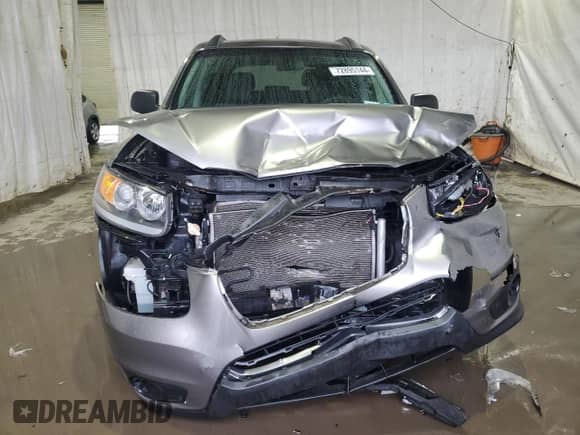 2012 Hyundai Santa Fe GLS с VIN 5XYZGDAB1CG163362, выставлен на аукционе Copart как лот 72895144 с пробегом 95 289 миль миль и Списание • Salvage title. История ставок и продаж доступна на DreamBid. Изображение 5.