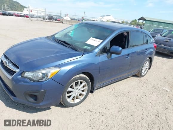 ✅ 2012 Subaru Impreza Premium • VIN: JF1GPAB62CH205915 • Lot: 43186070. Listed on IAAI with 100,976 mi. Free auction sales archive from the USA and detailed vehicle history report at DreamBid. Image 2.