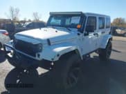 ✅ 2013 Jeep Wrangler Unlimited Sahara • VIN: 1C4BJWEG5DL554444 • Lot: 43561456. Listed on IAAI with 157,026 mi. Free auction sales archive from the USA and detailed vehicle history report at DreamBid. Image 2.