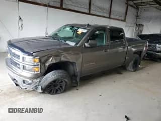2015 Chevrolet Silverado 1500 LT с VIN 3GCUKREC7FG447707, выставлен на аукционе Copart как лот 64144085 с пробегом 148 949 миль миль и Списание • Salvage title. История ставок и продаж доступна на DreamBid. Изображение 1.