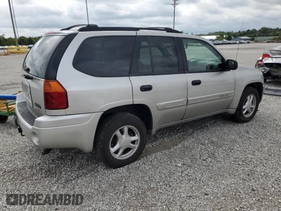 ✅ 2005 GMC Envoy SLE • VIN: 1GKDS13S752189079 • Лот: 71419365. Опубликован ранее на Copart с пробегом 122 219 миль. Бесплатный доступ к архиву аукционных продаж из США и подробный отчёт об истории автомобиля на DreamBid. Изображение 3.