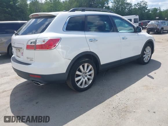 ✅ 2010 Mazda CX-9 Touring • VIN: JM3TB3MV5A0232035 • Lot: 42622694. Listed on IAAI with 103,024 mi. Free auction sales archive from the USA and detailed vehicle history report at DreamBid. Image 4.