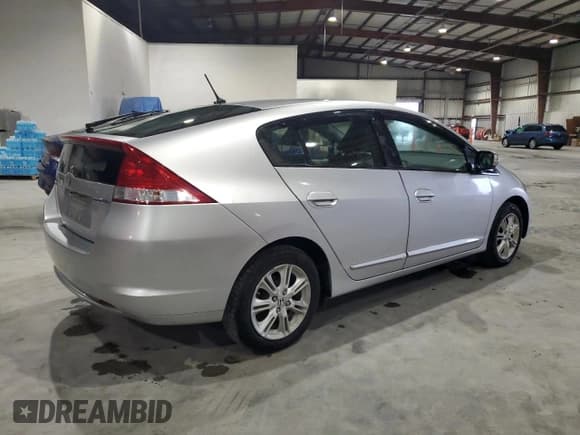 ✅ 2010 Honda Insight EX • VIN: JHMZE2H75AS003910 • Lot: 56485995. Listed on Copart with 104,685 mi. Free auction sales archive from the USA and detailed vehicle history report at DreamBid. Image 3.