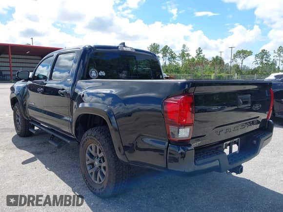 2022 Toyota Tacoma SR5 with VIN 3TMAZ5CN4NM164094, listed as a IAAI auction lot 43409274 with 38,585 mi miles and . Bid and sale history available at DreamBid. Image 3.
