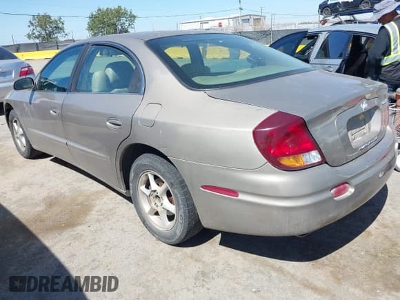 ✅ 2001 Oldsmobile Aurora • VIN: 1G3GR62H414102471 • Lot: 42312588. Listed on IAAI with Not provided. Free auction sales archive from the USA and detailed vehicle history report at DreamBid. Image 3.