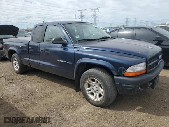 2002 Dodge Dakota Sport z VIN 1B7GL32X12S716897, wystawiony jako Copart lot #54347825 z przebiegiem 85 820 mil mil oraz Czysty tytuł • Clean title. Historia ofert i sprzedaży dostępna na DreamBid. Obrazek 4.