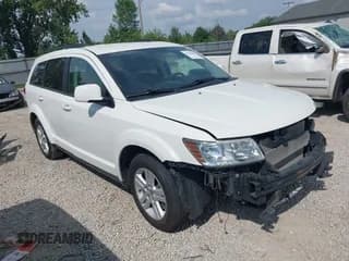 ✅ 2012 Dodge Journey SXT • VIN: 3C4PDCBB0CT323569 • Lot: 42748440. Listed on IAAI with 141,950 mi. Free auction sales archive from the USA and detailed vehicle history report at DreamBid. Image 1.