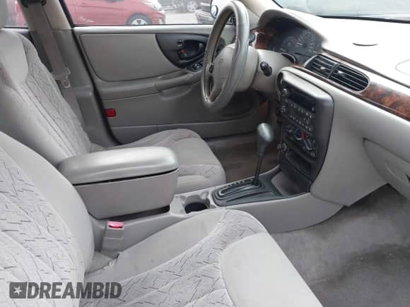 2003 Chevrolet Malibu LS z VIN 1G1NE52JX3M704142, wystawiony jako IAAI lot #41470918 z przebiegiem 146 121 mil mil oraz . Historia ofert i sprzedaży dostępna na DreamBid. Obrazek 5.