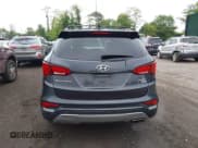 ✅ 2017 Hyundai Santa Fe 2.4L • VIN: 5XYZUDLB5HG397310 • Lot: 42314099. Listed on IAAI with 99,061 mi. Free auction sales archive from the USA and detailed vehicle history report at DreamBid. Image 16.