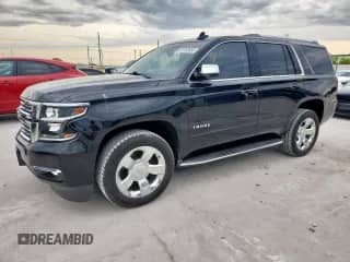 2020 Chevrolet Tahoe Premier z VIN 1GNSCCKC8LR188993, wystawiony jako Copart lot #60122655 z przebiegiem 103 415 mil mil oraz Czysty tytuł • Clean title. Historia ofert i sprzedaży dostępna na DreamBid. Obrazek 1.