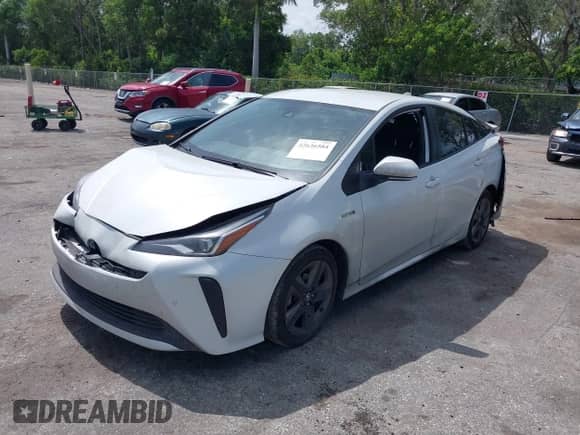 2021 Toyota Prius L Eco with VIN JTDKAMFU4M3149362, listed as a IAAI auction lot 42636584 with 180,786 mi miles and . Bid and sale history available at DreamBid. Image 2.