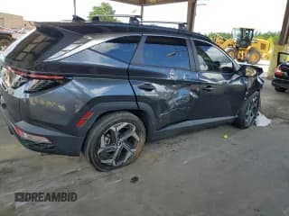✅ 2022 Hyundai Tucson SEL • VIN: 5NMJC3AE2NH099628 • Lot: 69115424. Wystawiony na Copart z przebiegiem Nie podano. Bezpłatny archiwum sprzedaży aukcyjnych z USA i szczegółowy raport historii pojazdu na DreamBid. Zdjęcie 3.