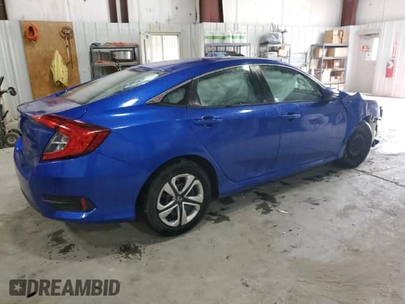 ✅ 2018 Honda Civic LX • VIN: 19XFC2F54JE025038 • Лот: 90214305. Опубликован ранее на Copart с пробегом 98 335 миль. Бесплатный доступ к архиву аукционных продаж из США и подробный отчёт об истории автомобиля на DreamBid. Изображение 3.