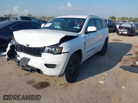 2022 Jeep Grand Cherokee Laredo E with VIN 1C4RJEAGXNC127857, listed as a IAAI auction lot 43202403 with 66,201 mi miles and . Bid and sale history available at DreamBid. Image 17.