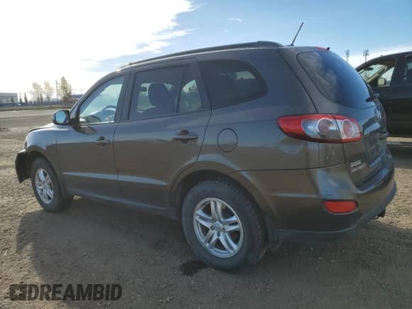 2012 Hyundai Santa Fe GLS with VIN 5XYZGDAG7CG144858, listed as a Copart auction lot 89706175 with 219,169 mi miles and Salvage title. Bid and sale history available at DreamBid. Image 2.