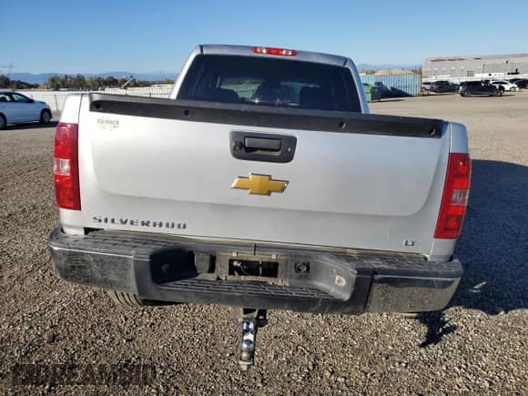 2013 Chevrolet Silverado 1500 LT with VIN 3GCPKSE71DG370823, listed as a Copart auction lot 90091465 with 128,265 mi miles and Salvage title. Bid and sale history available at DreamBid. Image 6.