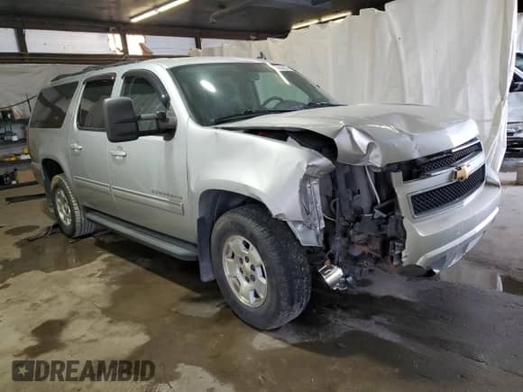 2013 Chevrolet Suburban LS с VIN 1GNSKHE72DR266801, выставлен на аукционе Copart как лот 71655405 с пробегом 214 077 миль миль и Списание • Salvage title. История ставок и продаж доступна на DreamBid. Изображение 4.