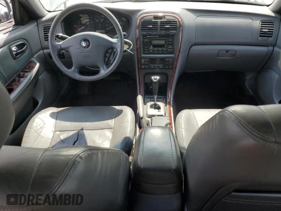 ✅ 2006 Kia Optima LX • VIN: KNAGD126165454406 • Lot: 57502035. Wystawiony na Copart z przebiegiem 193 052 mil. Bezpłatny archiwum sprzedaży aukcyjnych z USA i szczegółowy raport historii pojazdu na DreamBid. Zdjęcie 8.