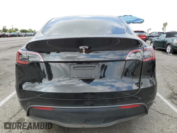 ✅ 2023 Tesla Model Y • VIN: 7SAYGDED1PF941165 • Lot: 71301845. Listed on Copart with 18,142 mi. Free auction sales archive from the USA and detailed vehicle history report at DreamBid. Image 6.