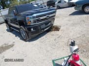 ✅ 2018 Chevrolet Silverado 2500HD High Country • VIN: 1GC1KXEY2JF276409 • Lot: 43179213. Listed on IAAI with 122,005 mi. Free auction sales archive from the USA and detailed vehicle history report at DreamBid. Image 1.