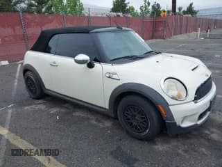 ✅ 2009 MINI Convertible S • VIN: WMWMS33529TG89023 • Lot: 42072518. Listed on IAAI with 127,735 mi. Free auction sales archive from the USA and detailed vehicle history report at DreamBid. Image 1.