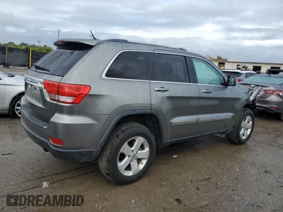 ✅ 2013 Jeep Grand Cherokee Laredo • VIN: 1C4RJFAG5DC559857 • Lot: 85663295. Listed on Copart with 181,585 mi. Free auction sales archive from the USA and detailed vehicle history report at DreamBid. Image 3.