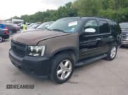 ✅ 2009 Chevrolet Tahoe LTZ • VIN: 1GNFC33J09R184315 • Lot: 42656000. Listed on IAAI with 216,835 mi. Free auction sales archive from the USA and detailed vehicle history report at DreamBid. Image 2.