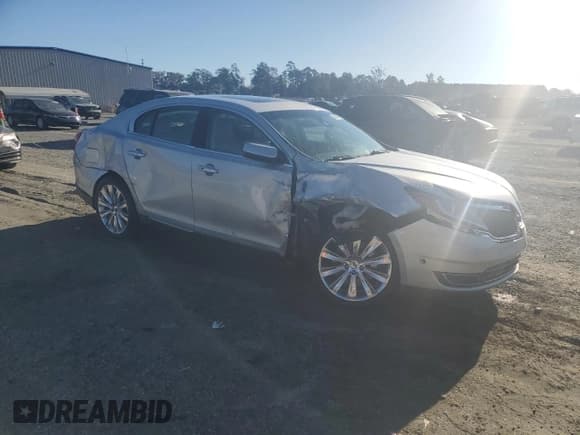 ✅ 2014 Lincoln MKS EcoBoost • VIN: 1LNHL9FT3EG600411 • Lot: 86684605. Listed on Copart with 76,702 mi. Free auction sales archive from the USA and detailed vehicle history report at DreamBid. Image 4.