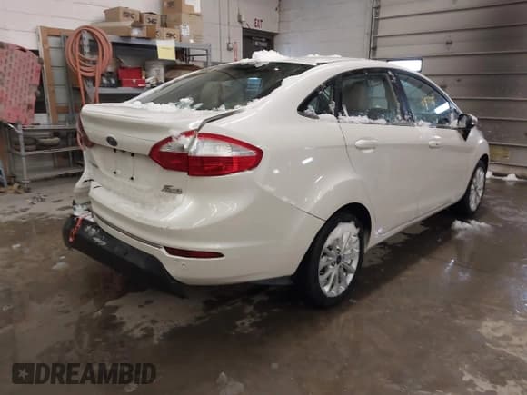 ✅ 2017 Ford Fiesta Titanium • VIN: 3FADP4CJ2HM123869 • Lot: 41571724. Wystawiony na IAAI z przebiegiem 103 452 mil. Bezpłatny archiwum sprzedaży aukcyjnych z USA i szczegółowy raport historii pojazdu na DreamBid. Zdjęcie 4.