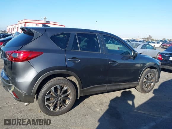 ✅ 2016 Mazda CX-5 Grand Touring • VIN: JM3KE4DY4G0853326 • Lot: 43589595. Wystawiony na IAAI z przebiegiem 69 517 mil. Bezpłatny archiwum sprzedaży aukcyjnych z USA i szczegółowy raport historii pojazdu na DreamBid. Zdjęcie 13.