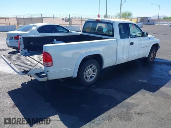 2002 Dodge Dakota Sport z VIN 1B7GL32X12S559114, wystawiony jako IAAI lot #42854090 z przebiegiem 141 238 mil mil oraz . Historia ofert i sprzedaży dostępna na DreamBid. Obrazek 4.