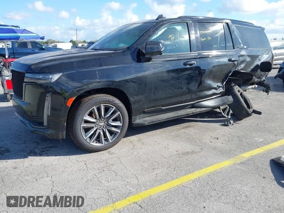 ✅ 2023 Cadillac Escalade 4WD Sport • VIN: 1GYS4EKL2PR351882 • Лот: 41555895. Опубликован ранее на IAAI с пробегом 58 703 миль. Бесплатный доступ к архиву аукционных продаж из США и подробный отчёт об истории автомобиля на DreamBid. Изображение 2.