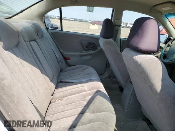 1998 Chevrolet Malibu LS z VIN 1G1NE52MXWY193037, wystawiony jako Copart lot #64394084 z przebiegiem 216 818 mil mil oraz Szkoda całkowita • Salvage title. Historia ofert i sprzedaży dostępna na DreamBid. Obrazek 10.