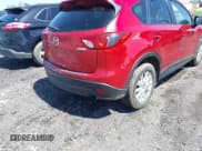✅ 2014 Mazda CX-5 Touring • VIN: JM3KE4CY5E0318214 • Lot: 42252680. Wystawiony na IAAI z przebiegiem 102 255 mil. Bezpłatny archiwum sprzedaży aukcyjnych z USA i szczegółowy raport historii pojazdu na DreamBid. Zdjęcie 4.